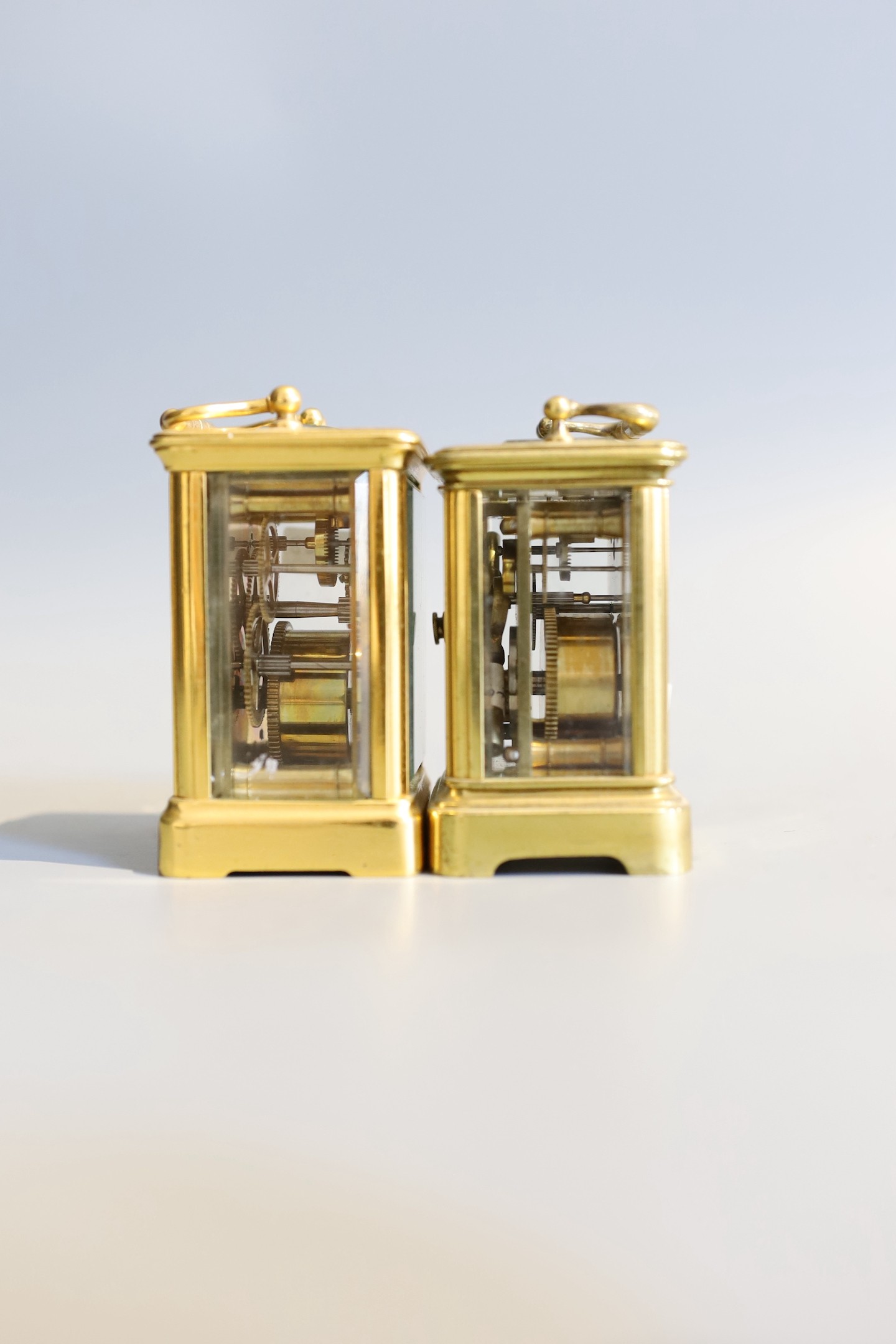 Two late 19th / early 20th century French lacquered brass miniature carriage timepieces, tallest 7cm